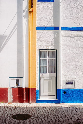 Colorful Portuguese Street Door with Blue and Yellow Walls