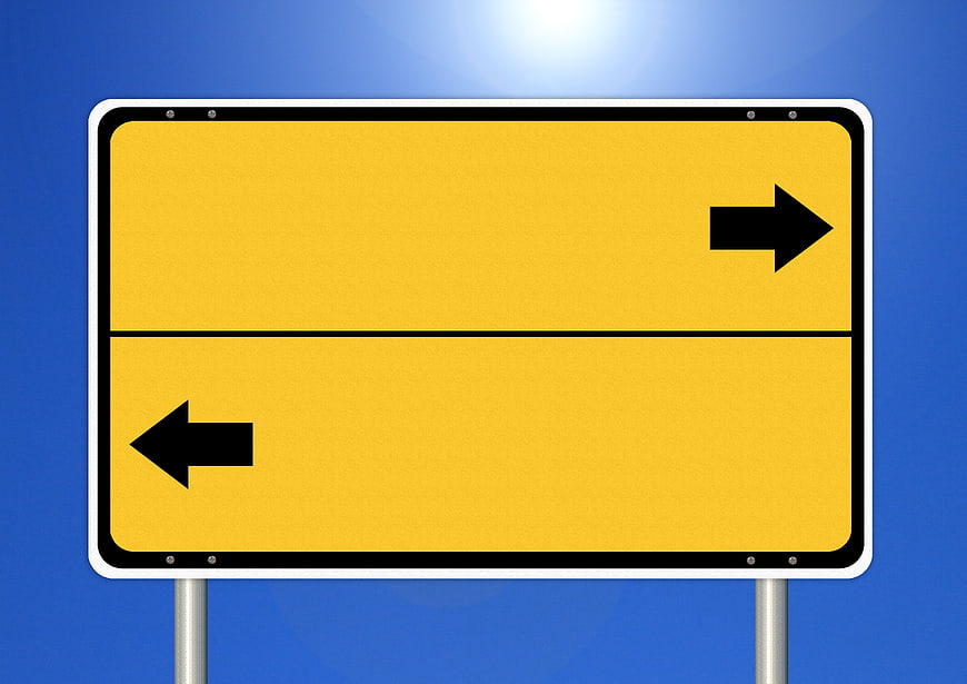 Empty Yellow Road Sign With Arrows On Blue Sky Background