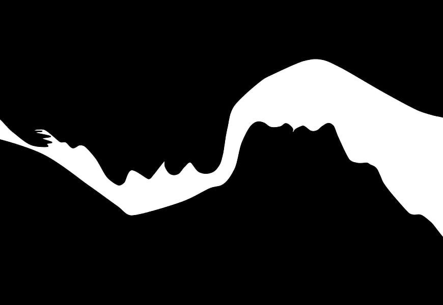 Black and white silhouette of a couple kissing