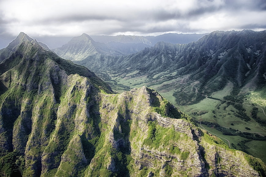 Aerial View of Lush Green Mountain Ranges and Valley