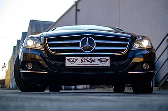 Front View of Black Mercedes-Benz with Detail Garage Plate