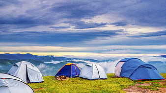 Mountain Camping Tents Above Sea of Clouds at Dawn