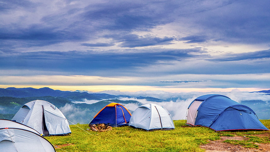 Mountain Camping Tents Above Sea of Clouds at Dawn