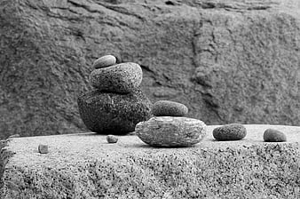 Black and white zen stone stack on textured rock
