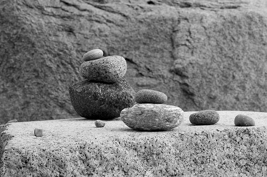 Black and white zen stone stack on textured rock