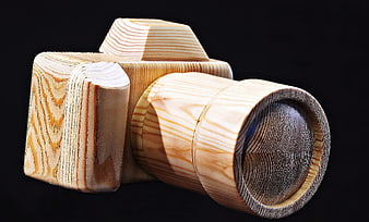 Handcrafted Wooden Camera Sculpture on Black Background