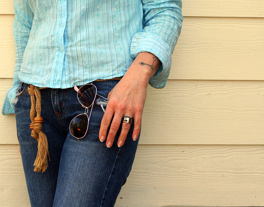Casual Fashion Detail with Jeans, Sunglasses, and Tassel Belt