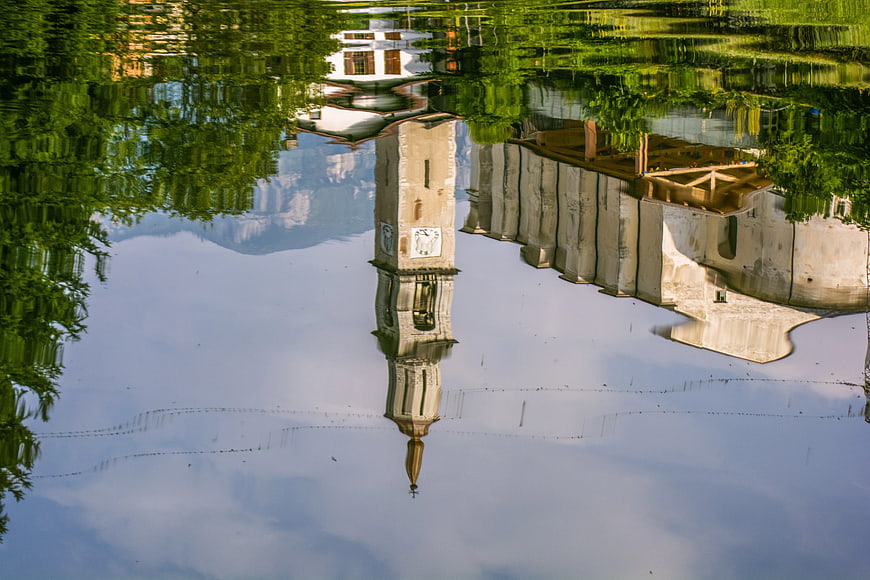 Inverted Reflection of Church Tower in Flooded Water