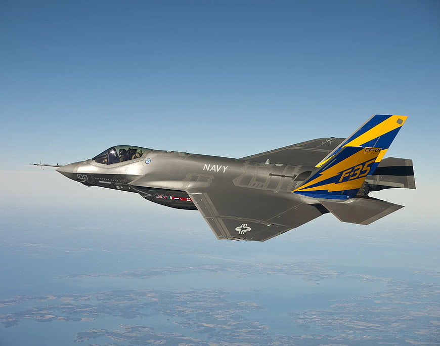 Navy F-35 Fighter Jet Flying in Clear Blue Sky