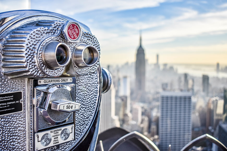 Coin-operated binoculars overlooking New York City skyline