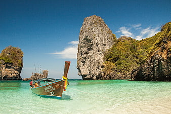 Traditional Thai Longtail Boat in Turquoise Lagoon