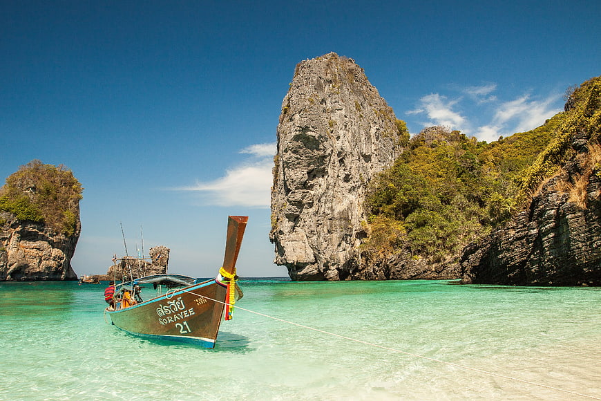 Traditional Thai Longtail Boat in Turquoise Lagoon