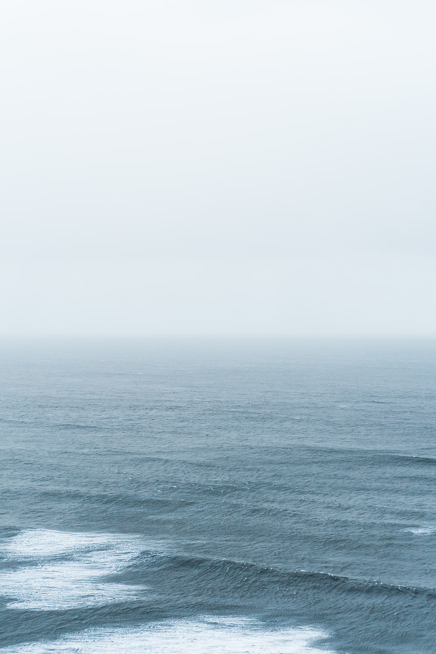Minimalist Misty Ocean Horizon with Gentle Waves