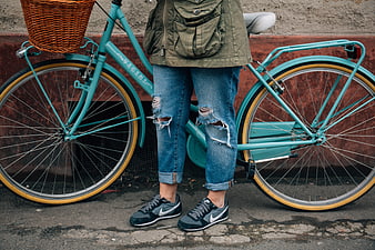 Person with Vintage Teal Bicycle and Wicker Basket