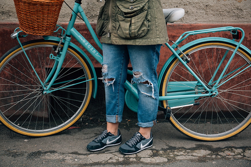 Person with Vintage Teal Bicycle and Wicker Basket