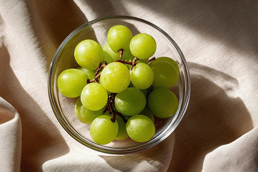 Top View of Fresh Green Grapes in Glass Bowl