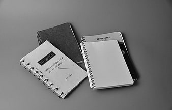 Vintage spiral notebooks and address books in black and white