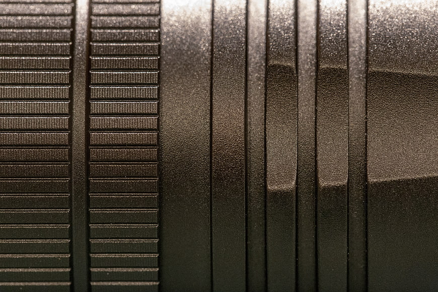 Close-up of black metal texture with industrial pattern