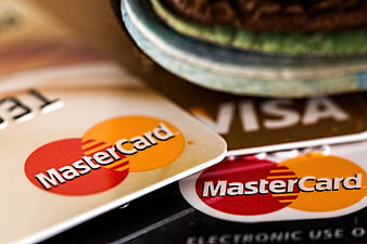 Close-up of Mastercard and Visa credit cards on a table