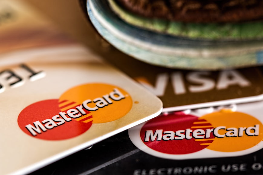 Close-up of Mastercard and Visa credit cards on a table