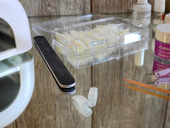 Nail Art Supplies and Tips on Glass Table