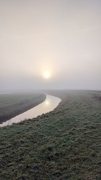 Frosty Canal Landscape with Foggy Sunrise