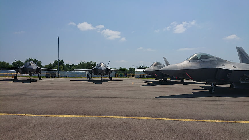 F-35 Lightning II fighter jets parked on airfield tarmac