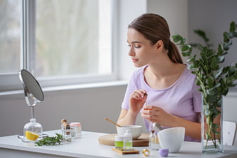 Woman making natural skincare products at home