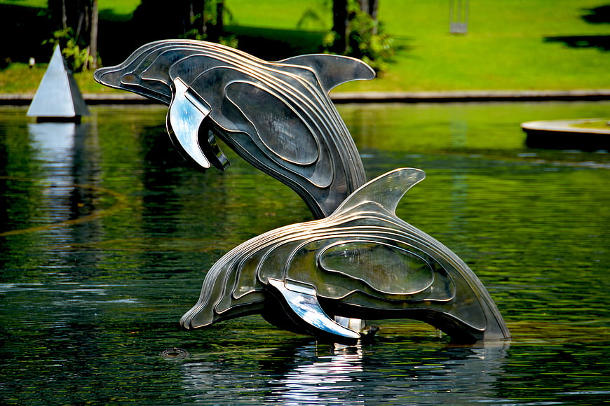 Modern Metal Dolphin Sculpture in Park Pond