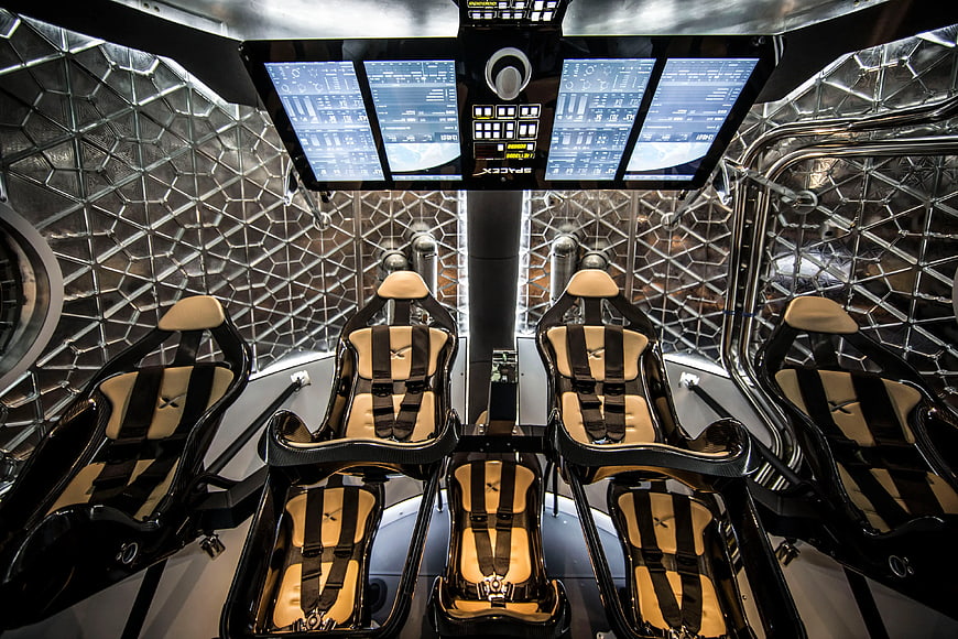 Futuristic spaceship cockpit interior with racing seats and digital displays