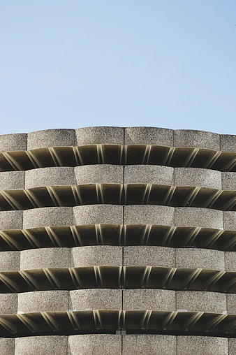 Modern Concrete Building Facade with Wavy Balconies
