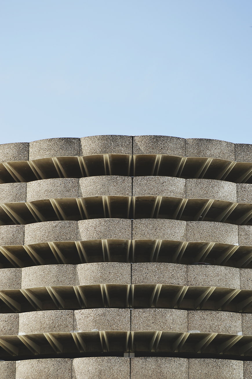 Modern Concrete Building Facade with Wavy Balconies