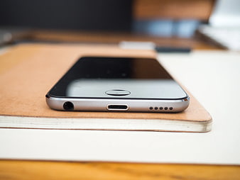 Close-up of Smartphone on Leather Notebook