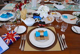 Elegant British themed table setting with Union Jack menu and white roses