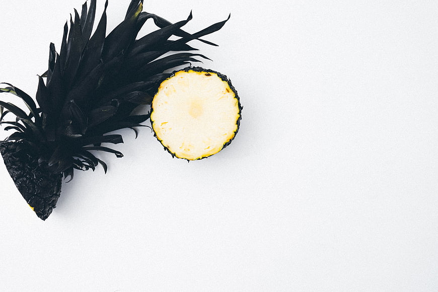 Black Painted Pineapple Slice on White Background