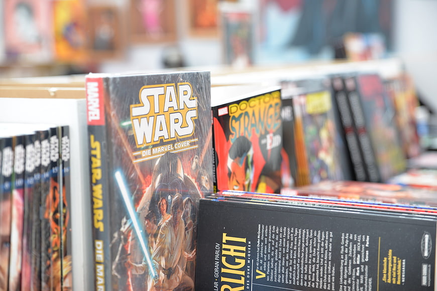 Star Wars and Doctor Strange comic books displayed on a retail shelf