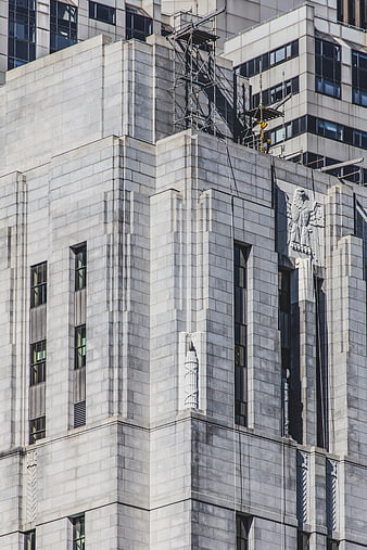 Art Deco Building Facade with Stone Eagle Sculpture