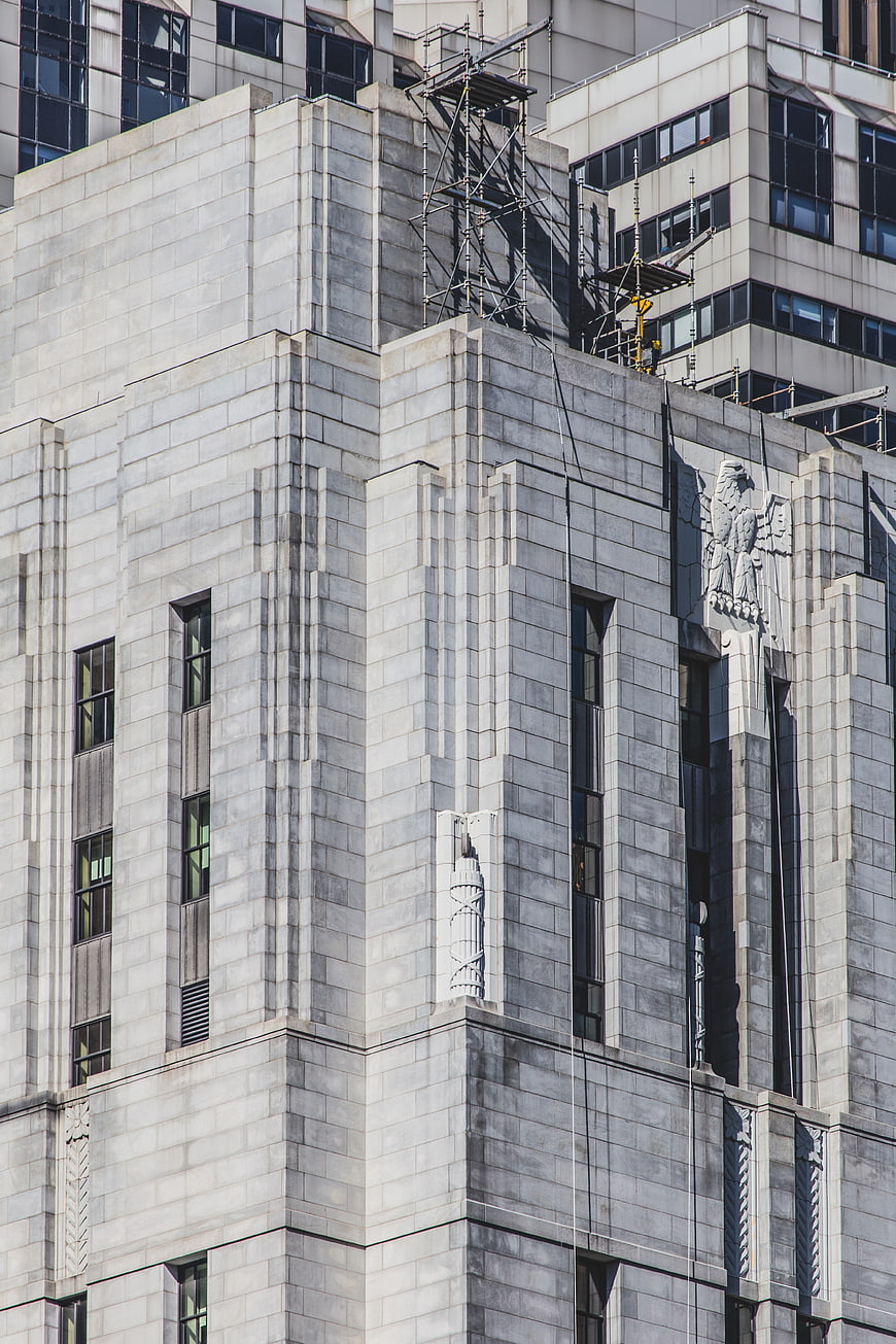Art Deco Building Facade with Stone Eagle Sculpture