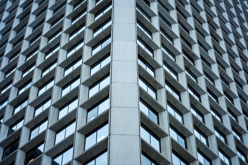 Modern Concrete Office Building Facade with Geometric Windows