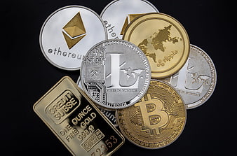 Physical Cryptocurrency Coins and Gold Bar on Black Background