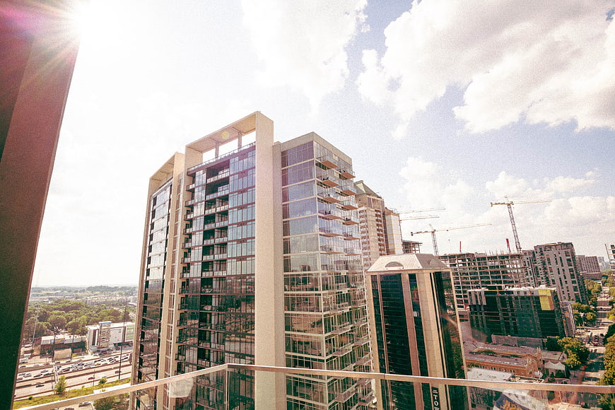 Modern High-Rise Apartment Building with Construction Cranes