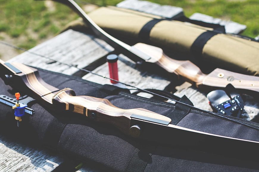 Close-up of wooden recurve bows on archery bag