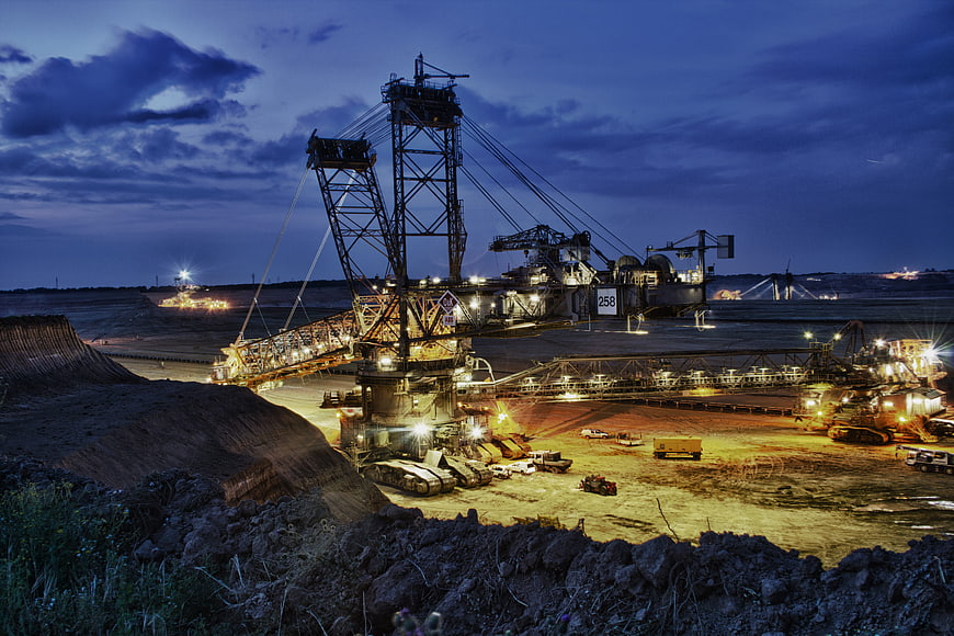 Massive Bucket Wheel Excavator Mining at Dusk