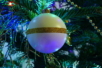White and Gold Christmas Ornament on Pine Tree