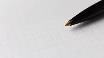 Black Pen Tip On White Grid Paper Close Up