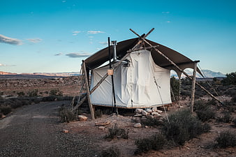 Glamping Tent in Desert Landscape with Mountains