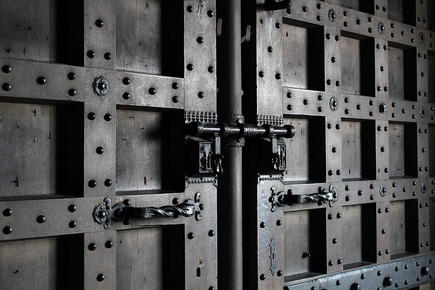 Close-up of ancient medieval iron and wood church door
