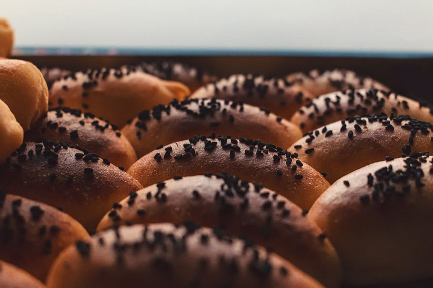Close-up of Freshly Baked Sesame Buns in a Tray