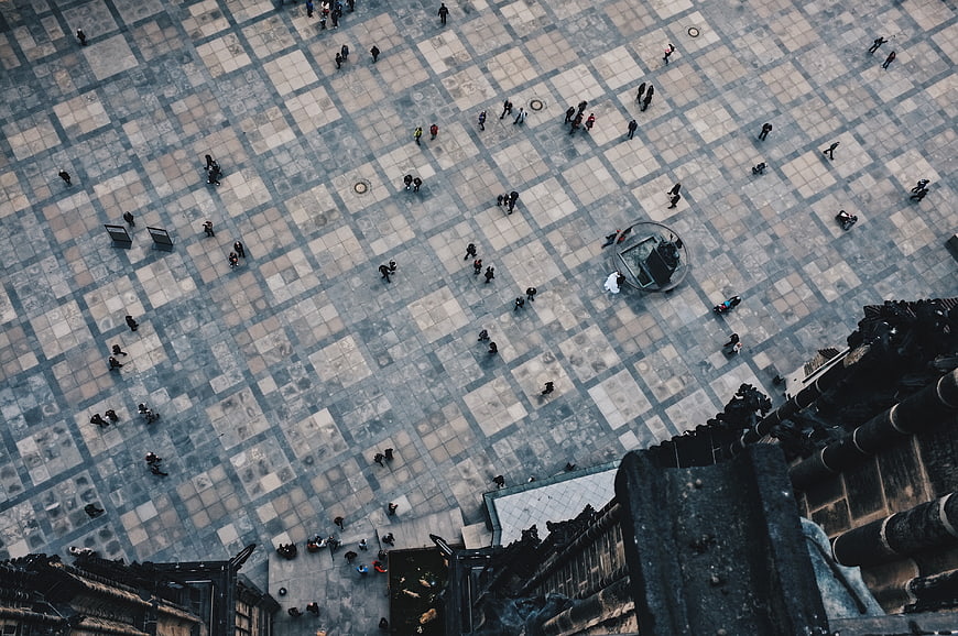 Aerial View of People Walking in a Large Urban Plaza