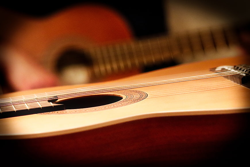 Close-up of Classical Guitar Sound Hole and Strings